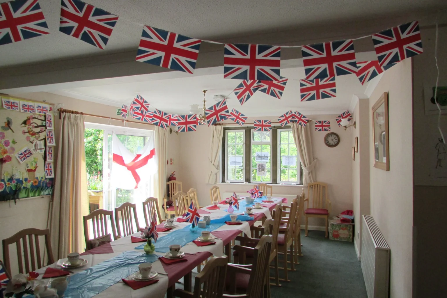 The Bridge House dining room decorated with flags and bunting for a celebration